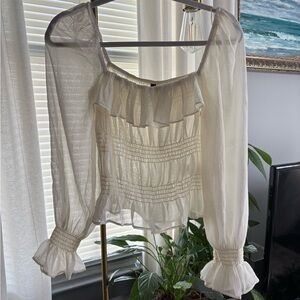H&M sheer cream shirt, great for layering. Only worn once size small